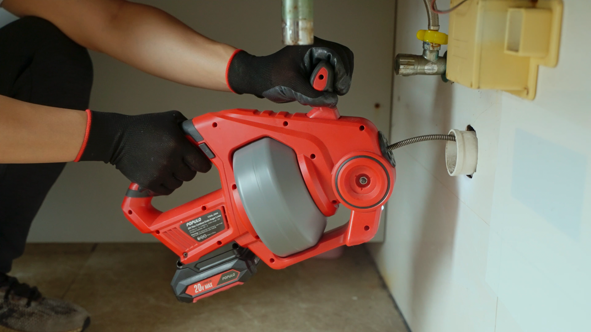 Using a Handheld Auger to Unclog a Sink